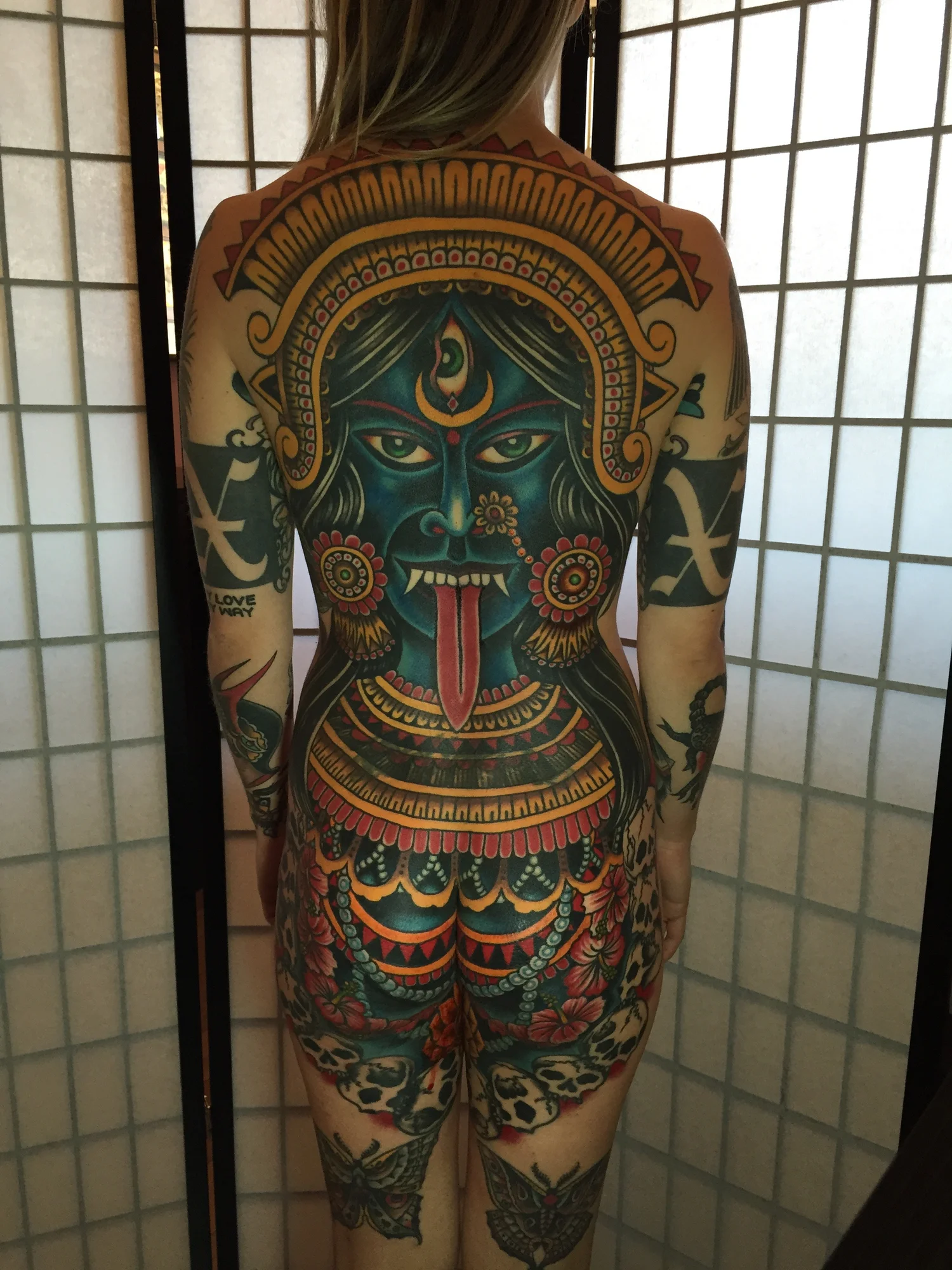 Custom illustrative full back tattoo