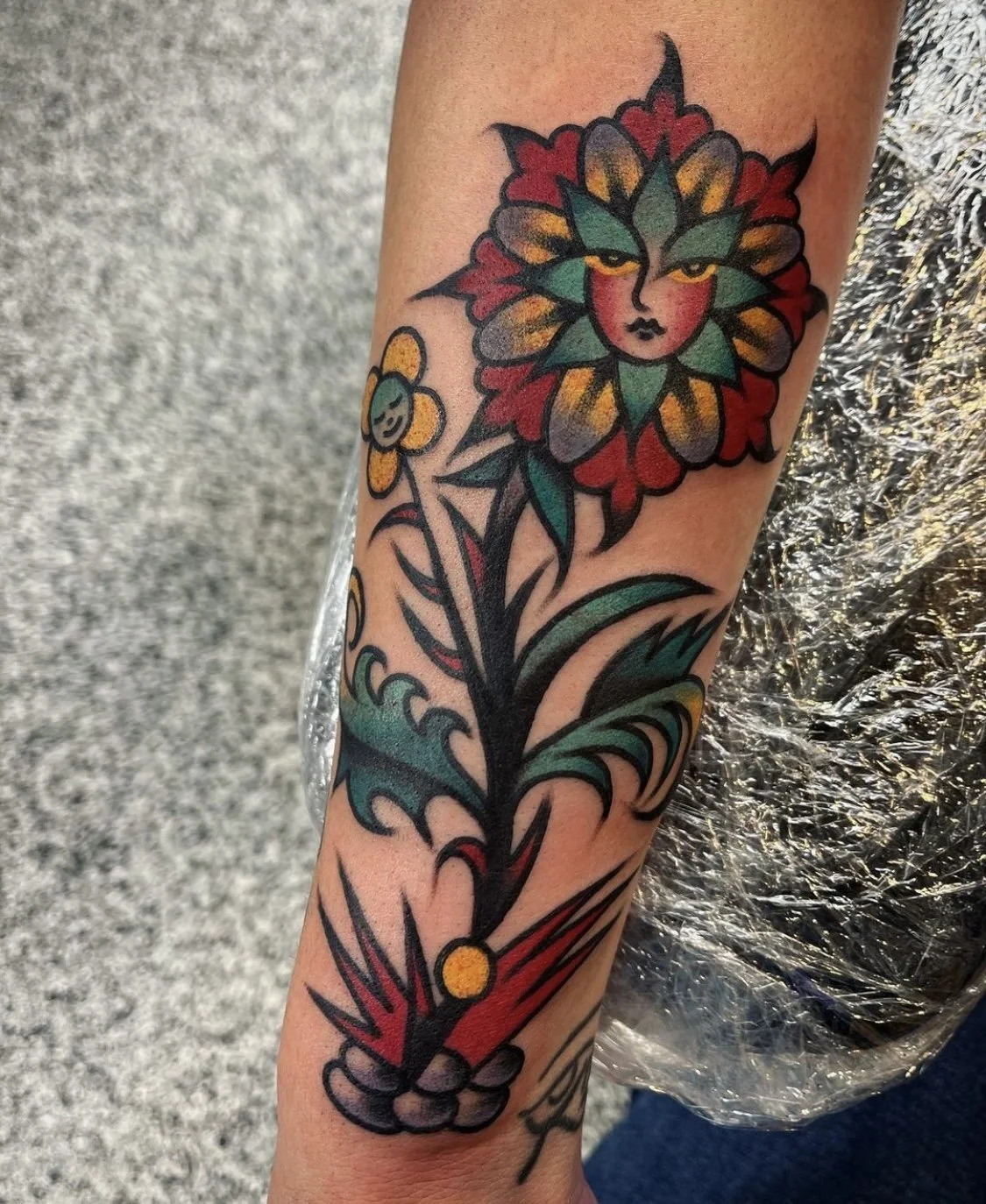 Traditional flower tattoo with bold color